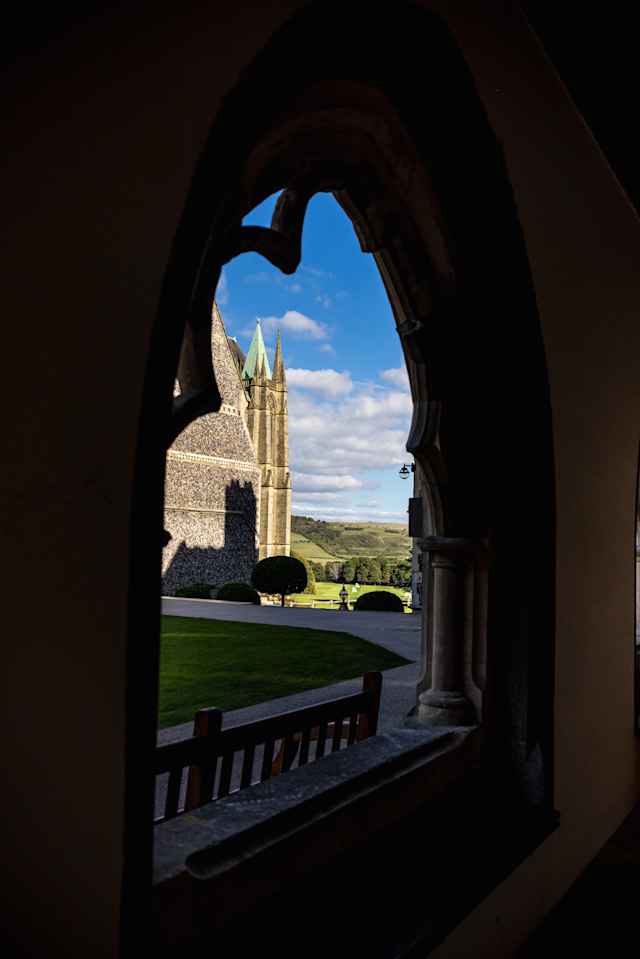 Lancing College - Chapel and campus through cloister Lancing College - Chapel and campus through cloister