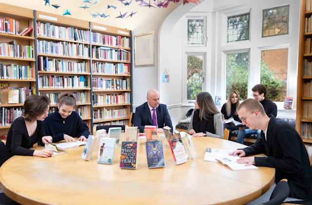 St Clare-s, Oxford - Students and teacher in the library Students in self-study time and one-on-one tutoring in the library