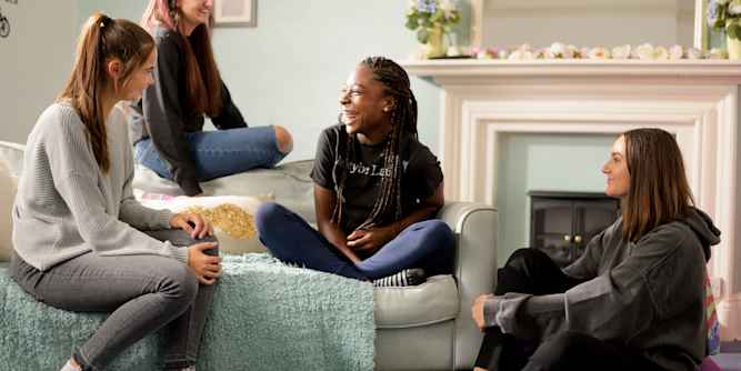 Box Hill School - Pupils in boarding house common room Box Hill School - Boarding pupils in boarding house common room wearing casual clothes