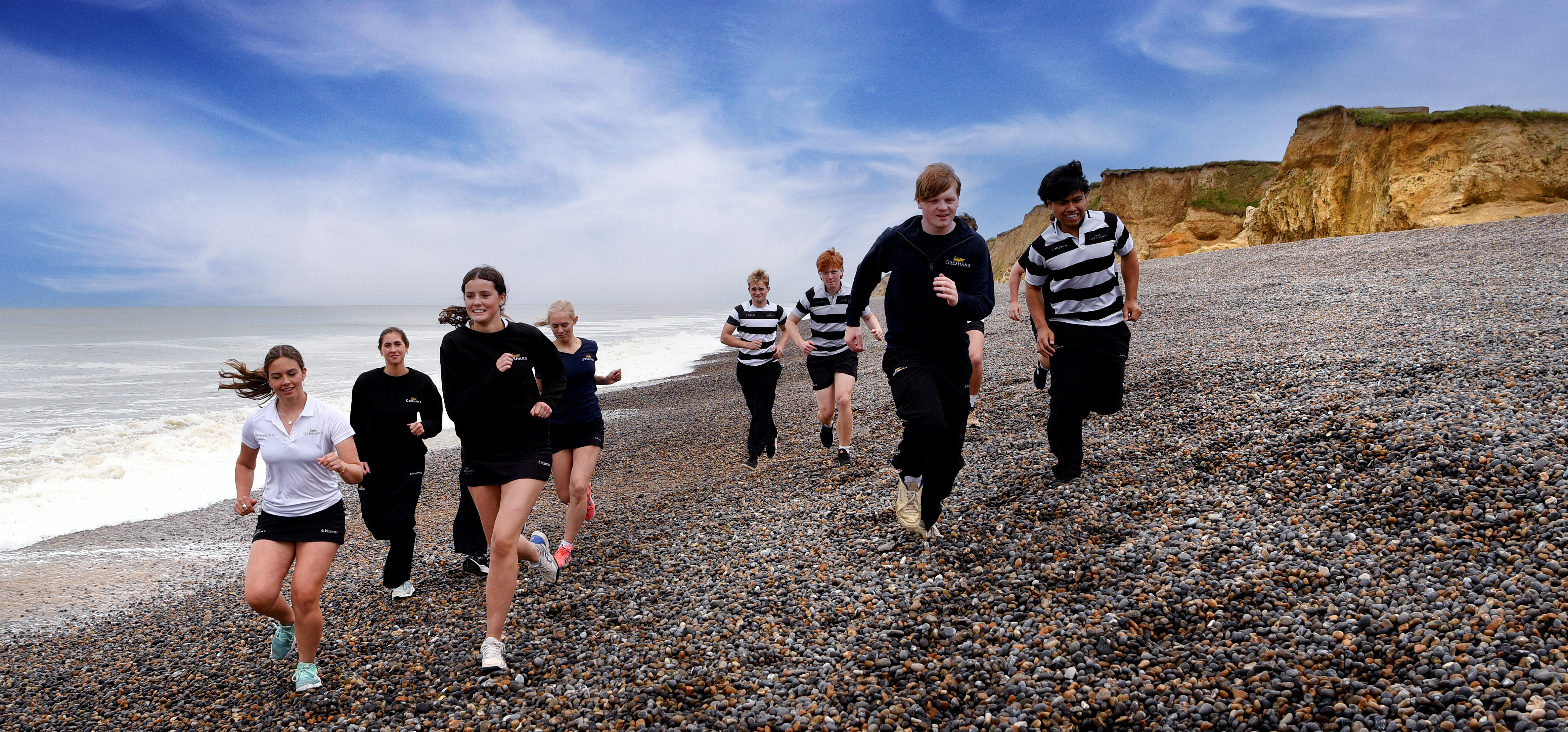 Gresham's School - students running on the beach on the North Norfolk Coast