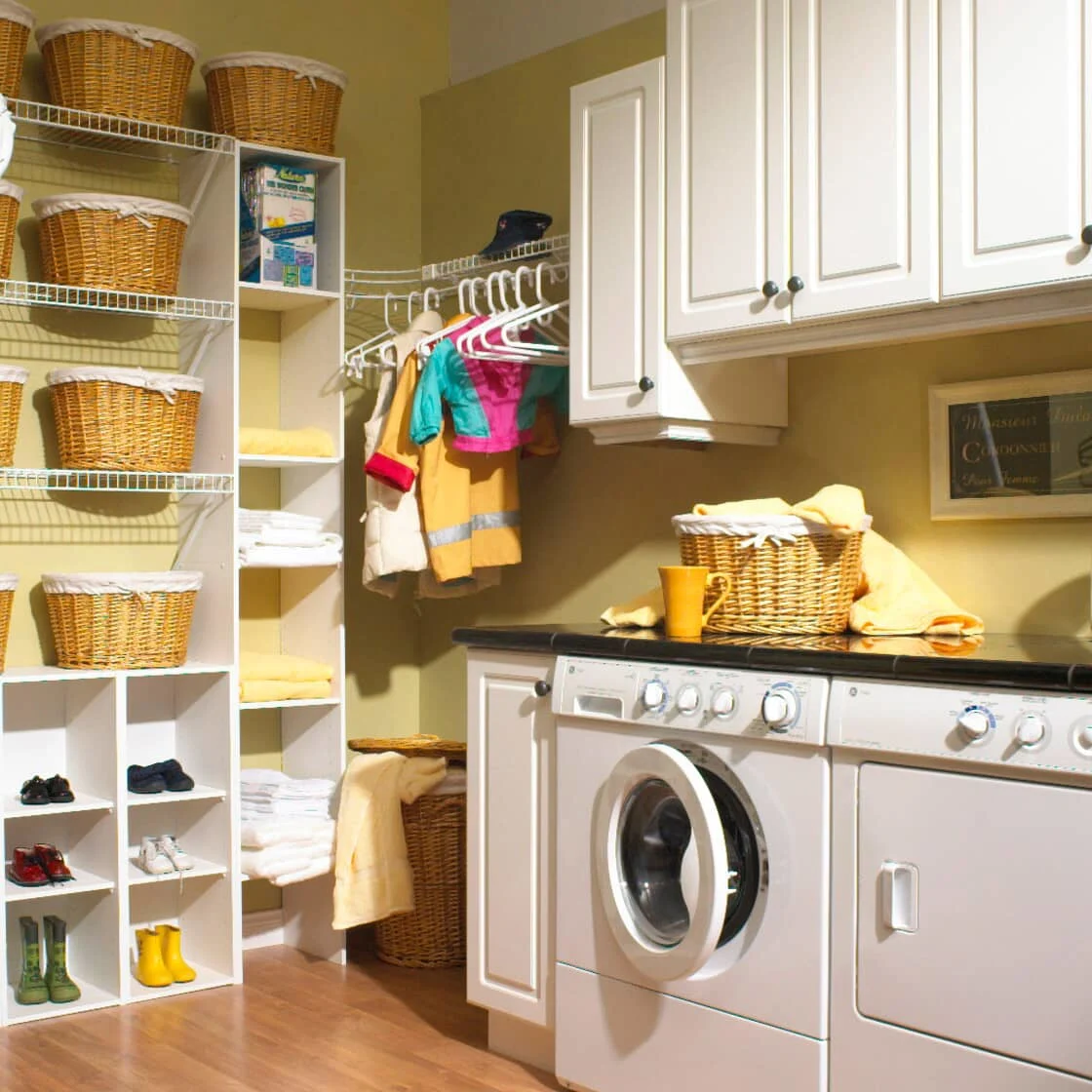 A laundry room with bags and baskets