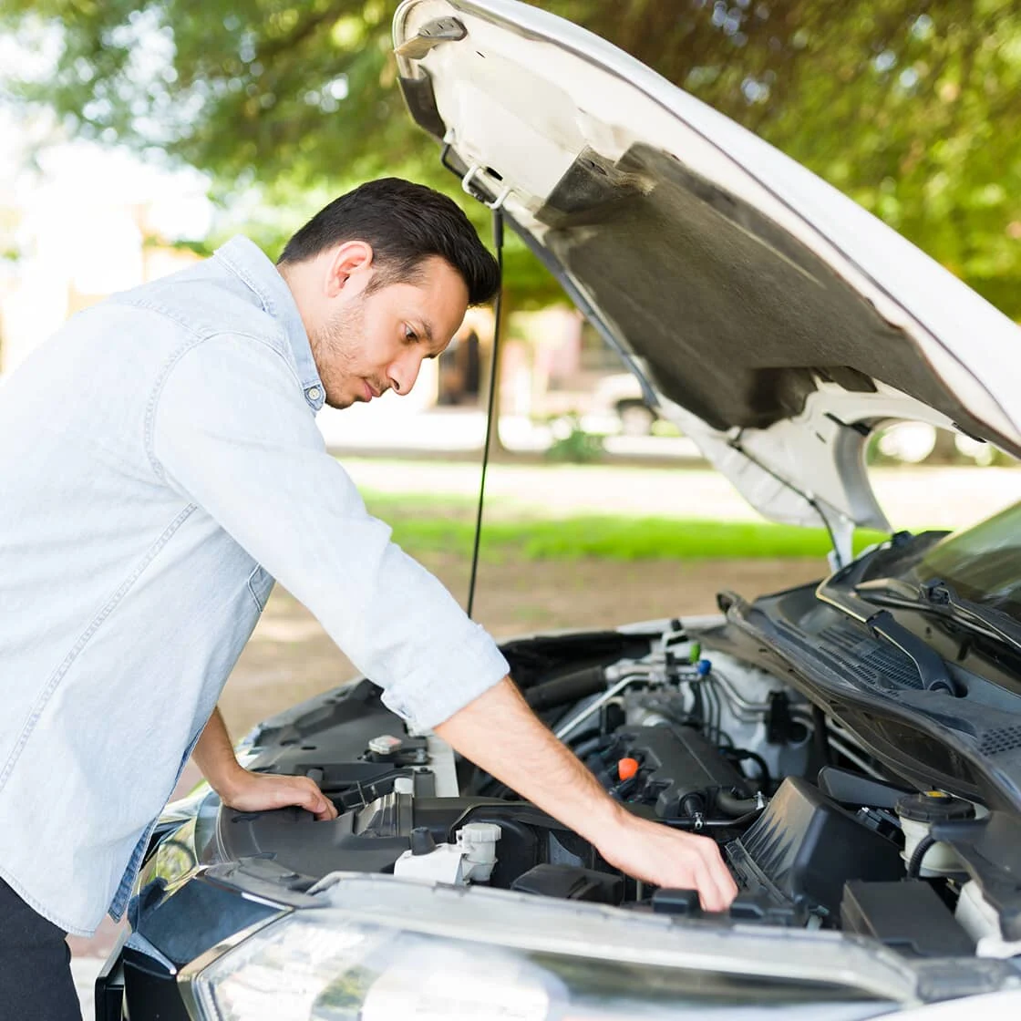 Someone checks the car