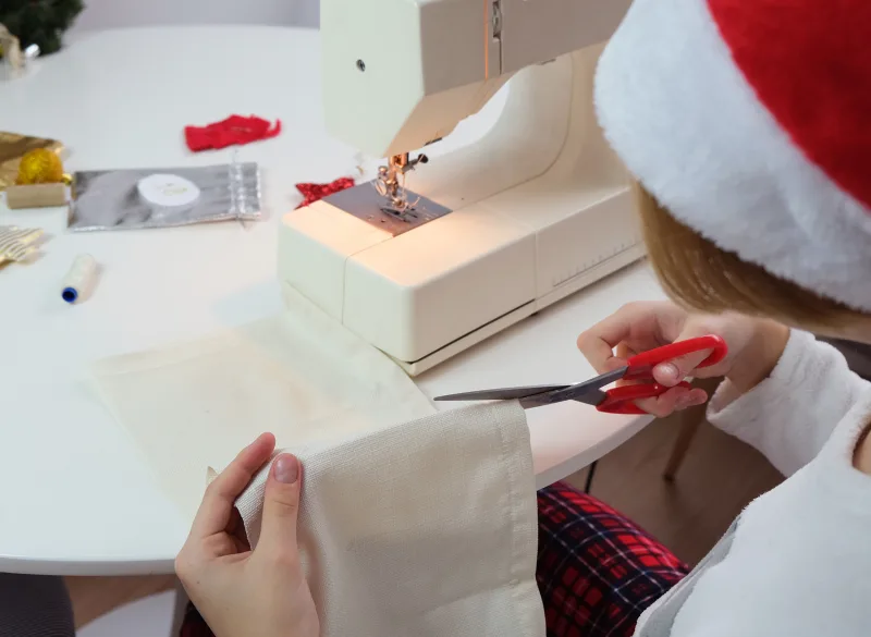 Someone making a gift bag with old linens