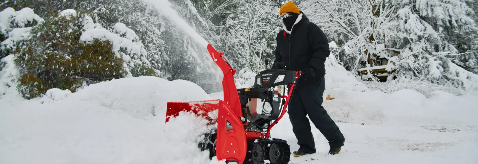 A man using a snow blower