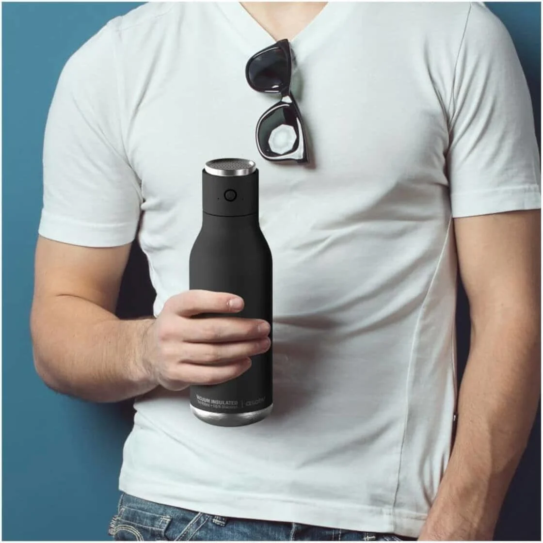 A man holds a water bottle.
