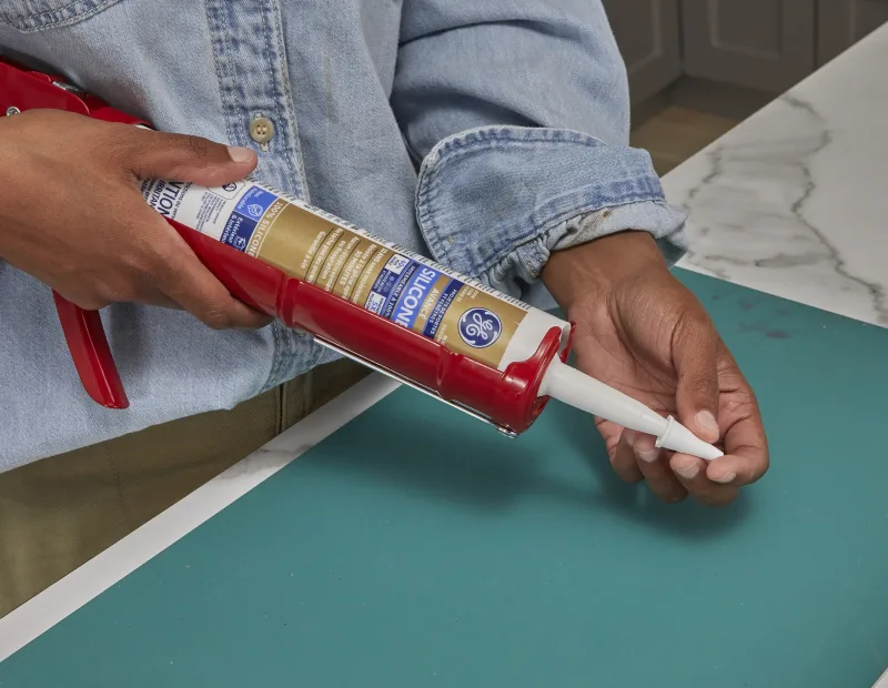 A woman closes the sealant package 