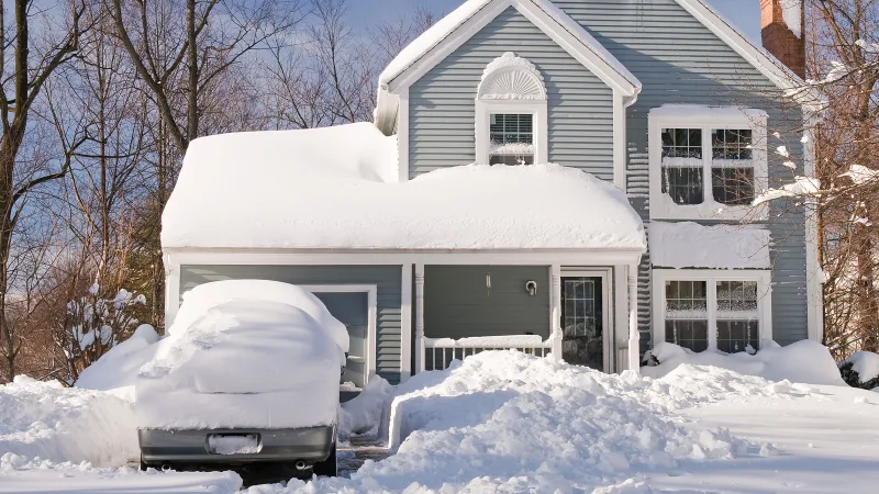 Car covered in snow after a snowstorm