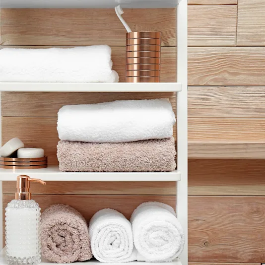 towels in stored in a bathroom