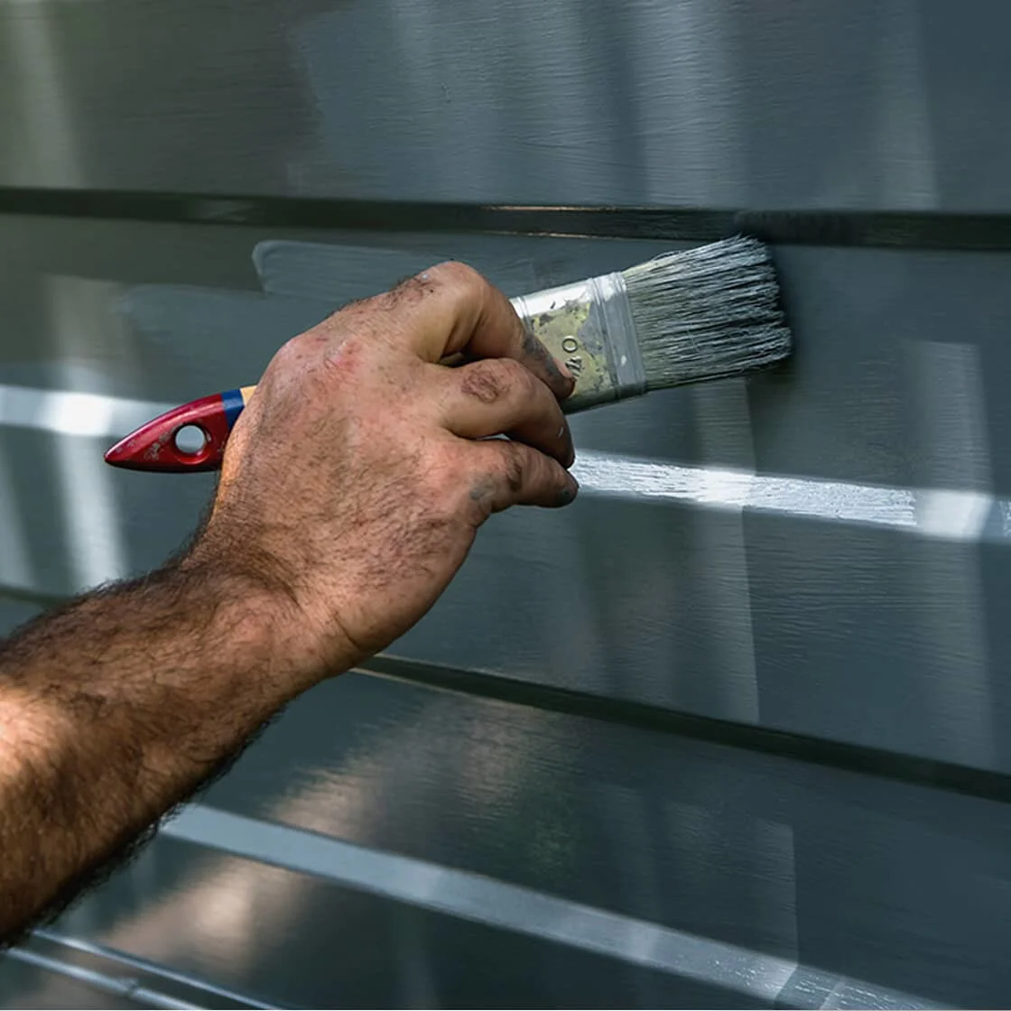 Someone paints the siding