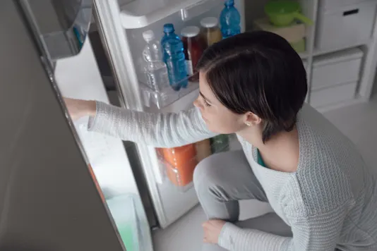 Someone cleaning out their fridge