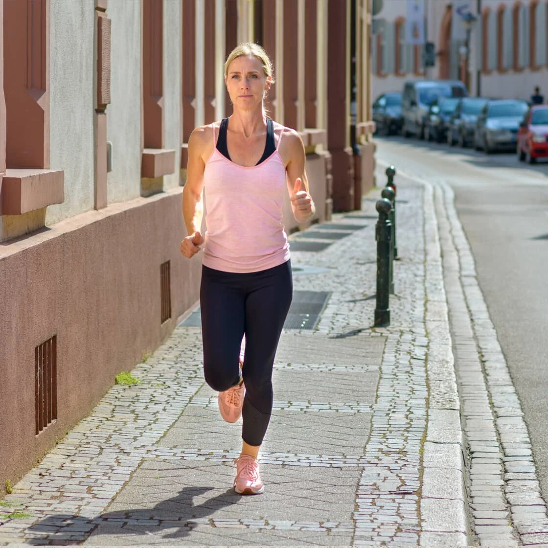 Jogger on a sunny city street