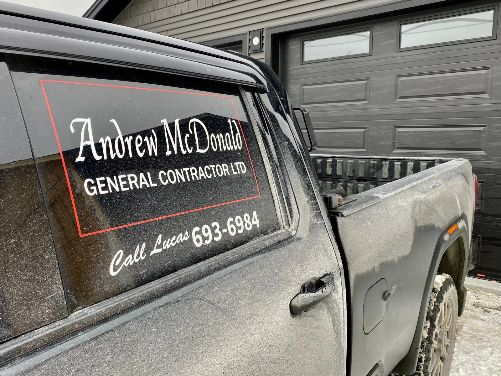 A truck with Andrew McDonald's logo on the window