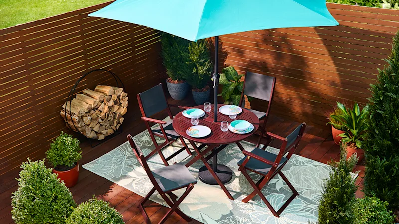 Dark, red wood patio dining set