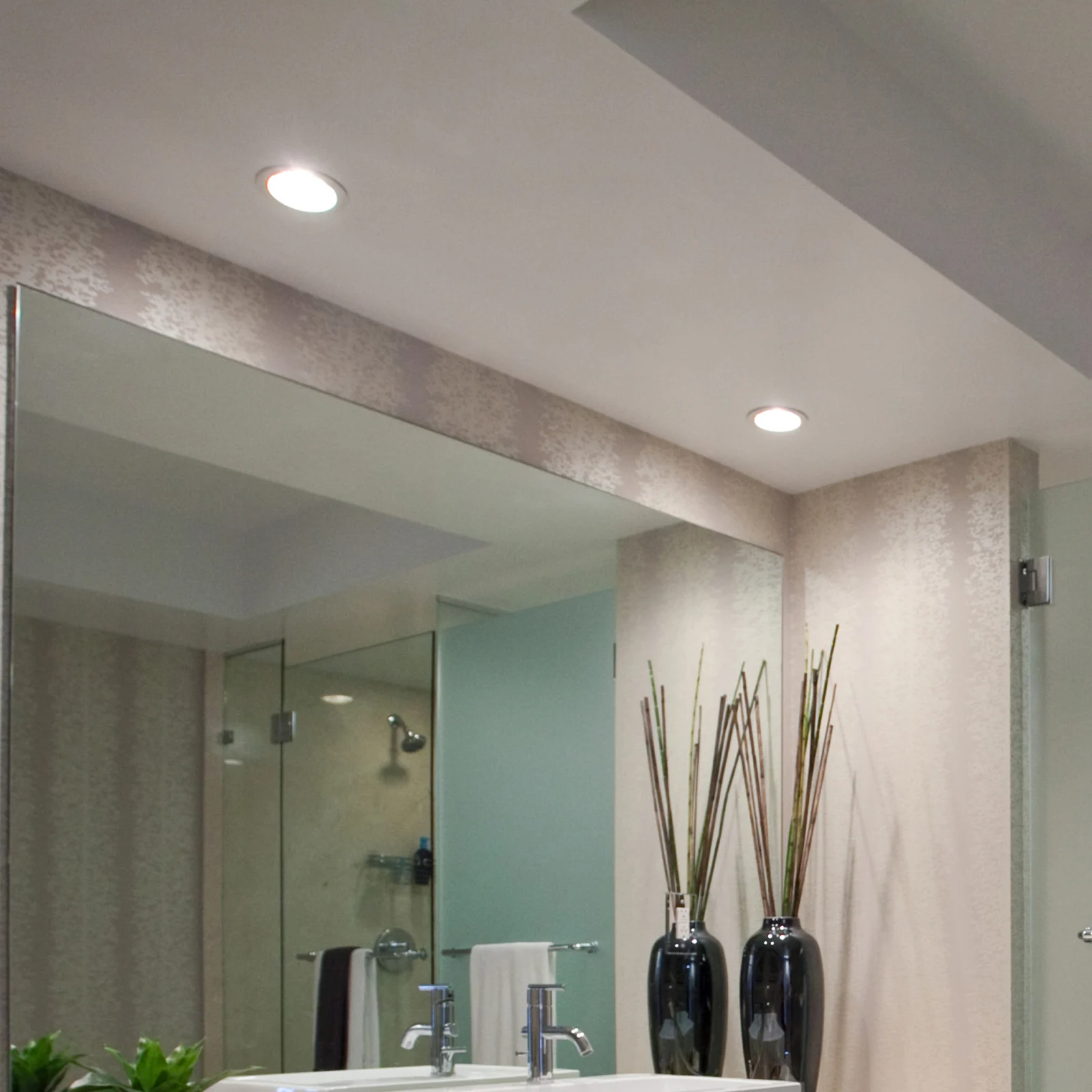 A bathroom with recessed lighting 
