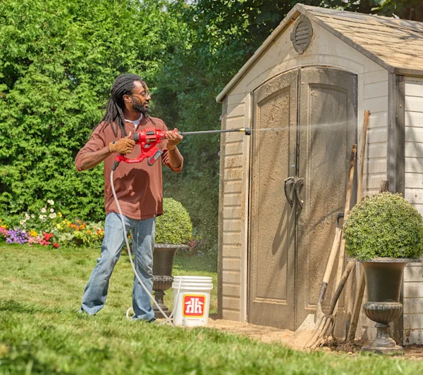 A man using a pressure washer