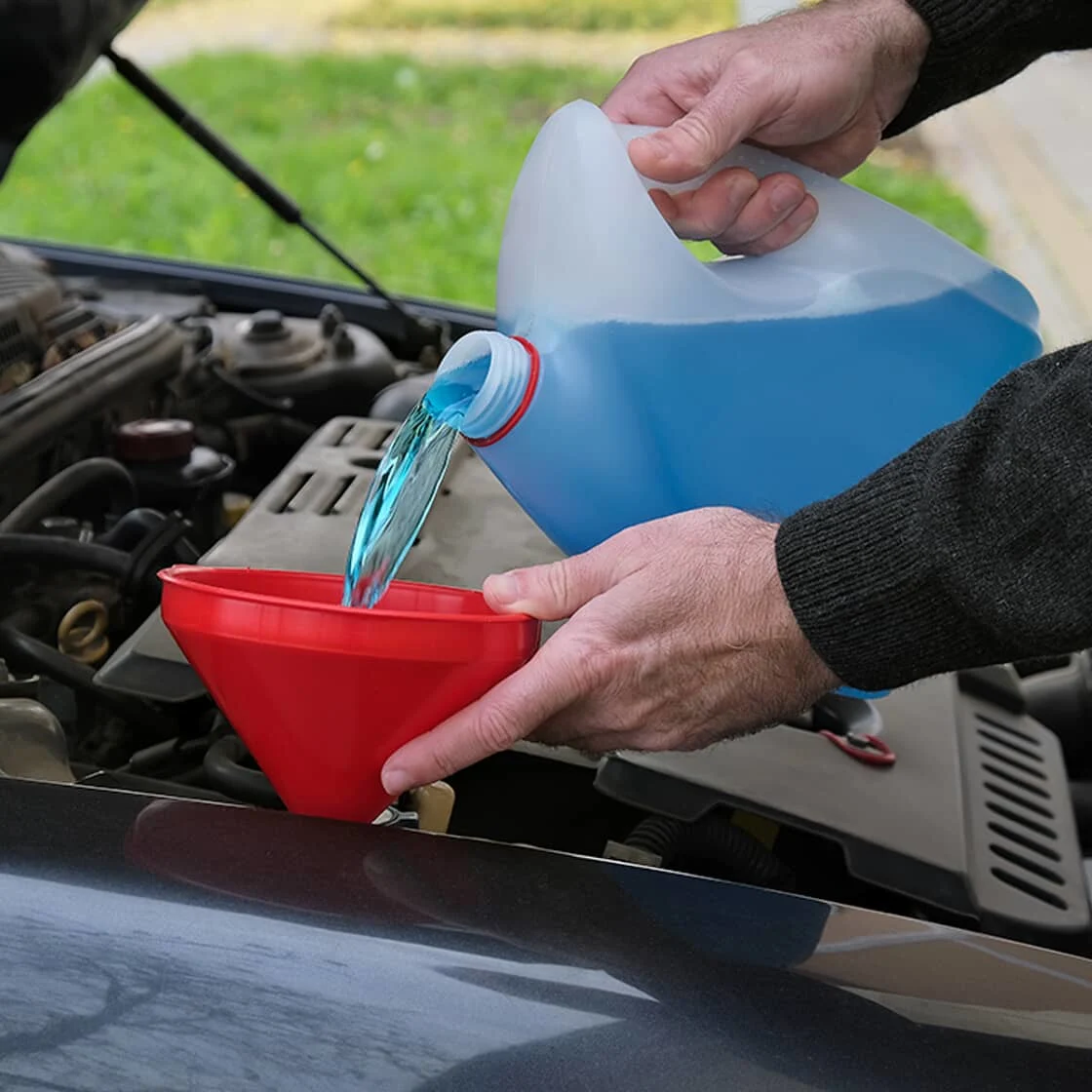 Someone pours anti-freeze