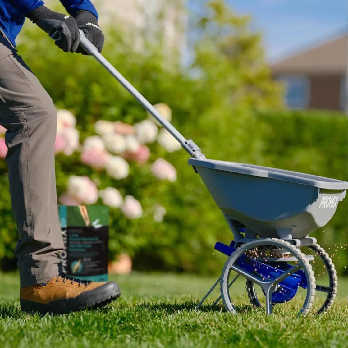 using spreader to plant seeds