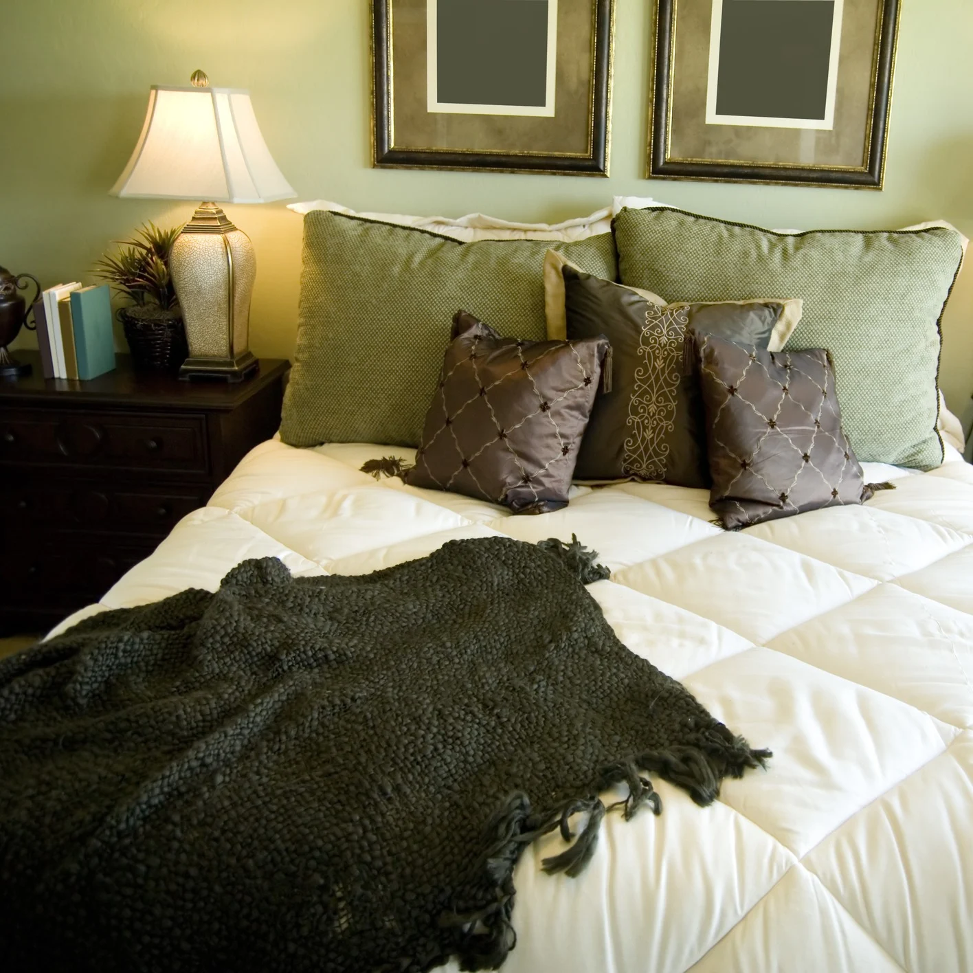 Bed in bedroom with green walls