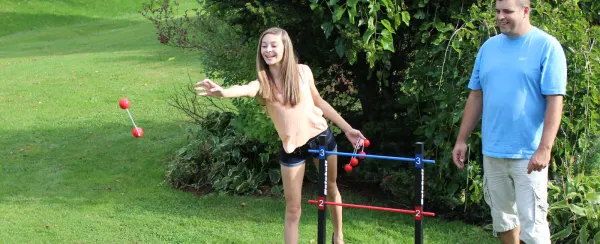 A father and daughter playing outside