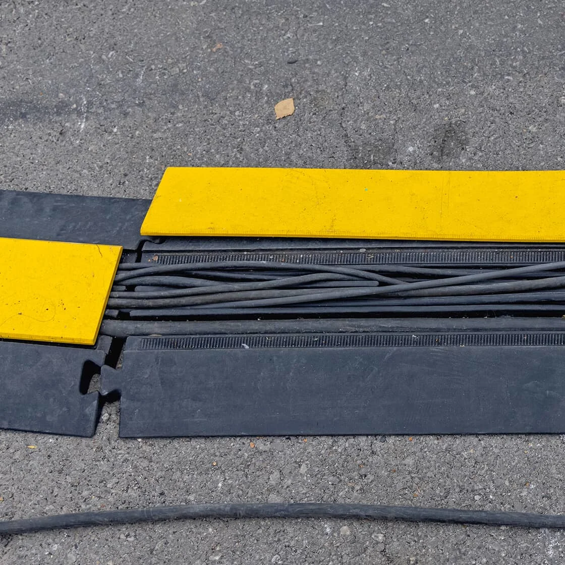 Wires covered by a floor ramp