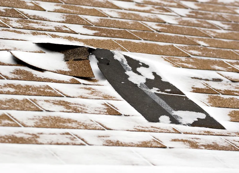 Damaged shingles in winter