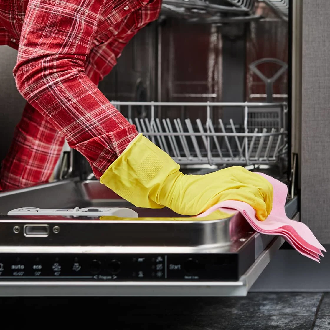 Someone cleans the dishwasher
