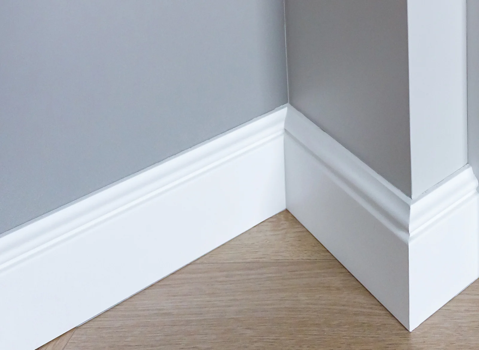 A closeup of white baseboards