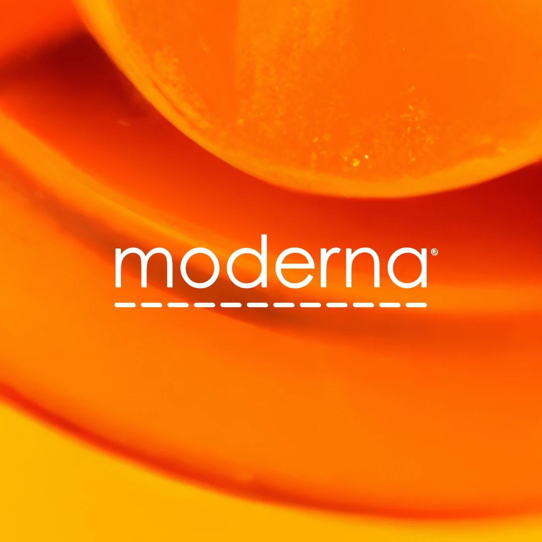 Moderna logo in white on a background of bright orange swirls