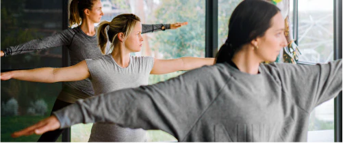 Three people doing yoga exercises