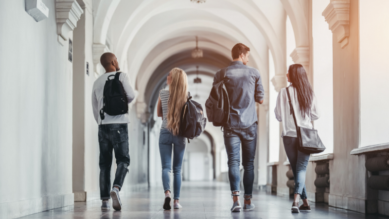 students-walking-through-university-corridor