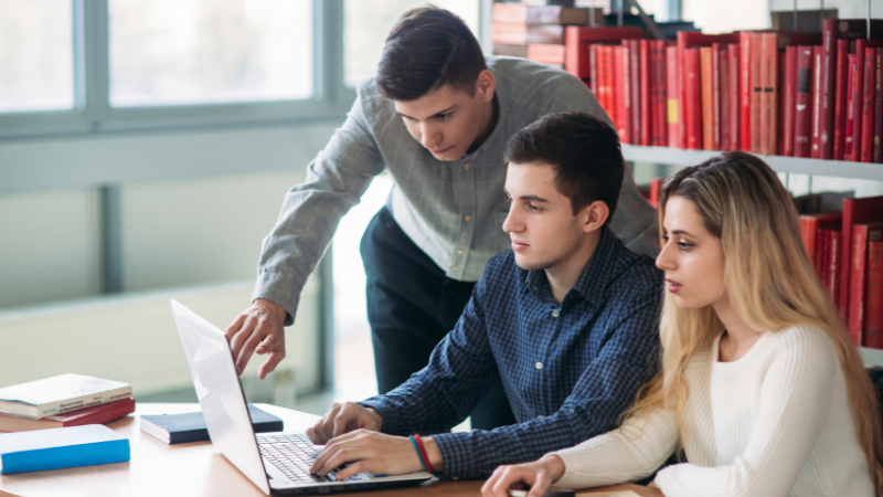 students-around-a-laptop