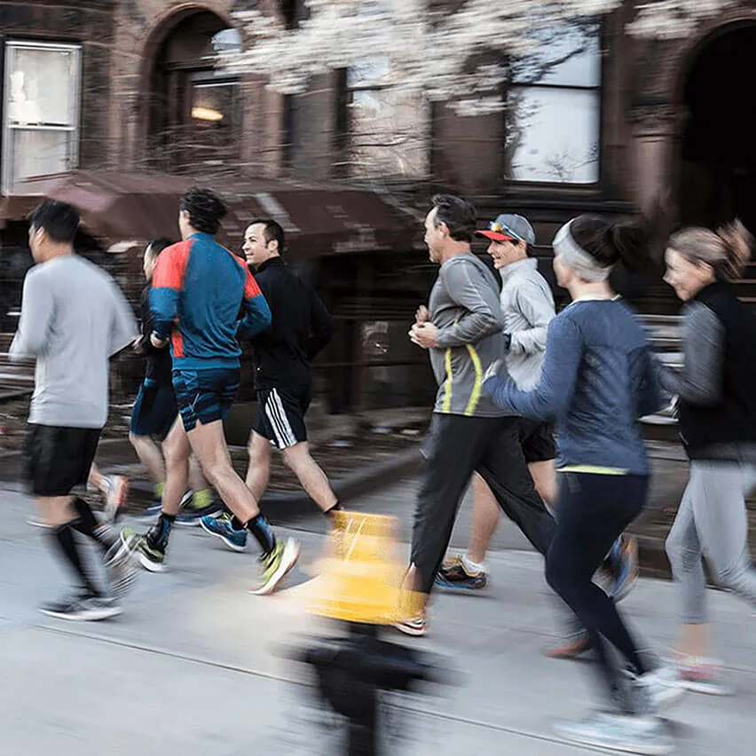 Group-running-on-sidewalk-in-Boston-listing