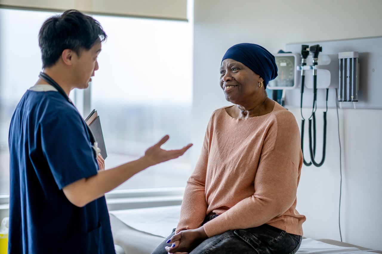 Nurse talking to woman with cancer