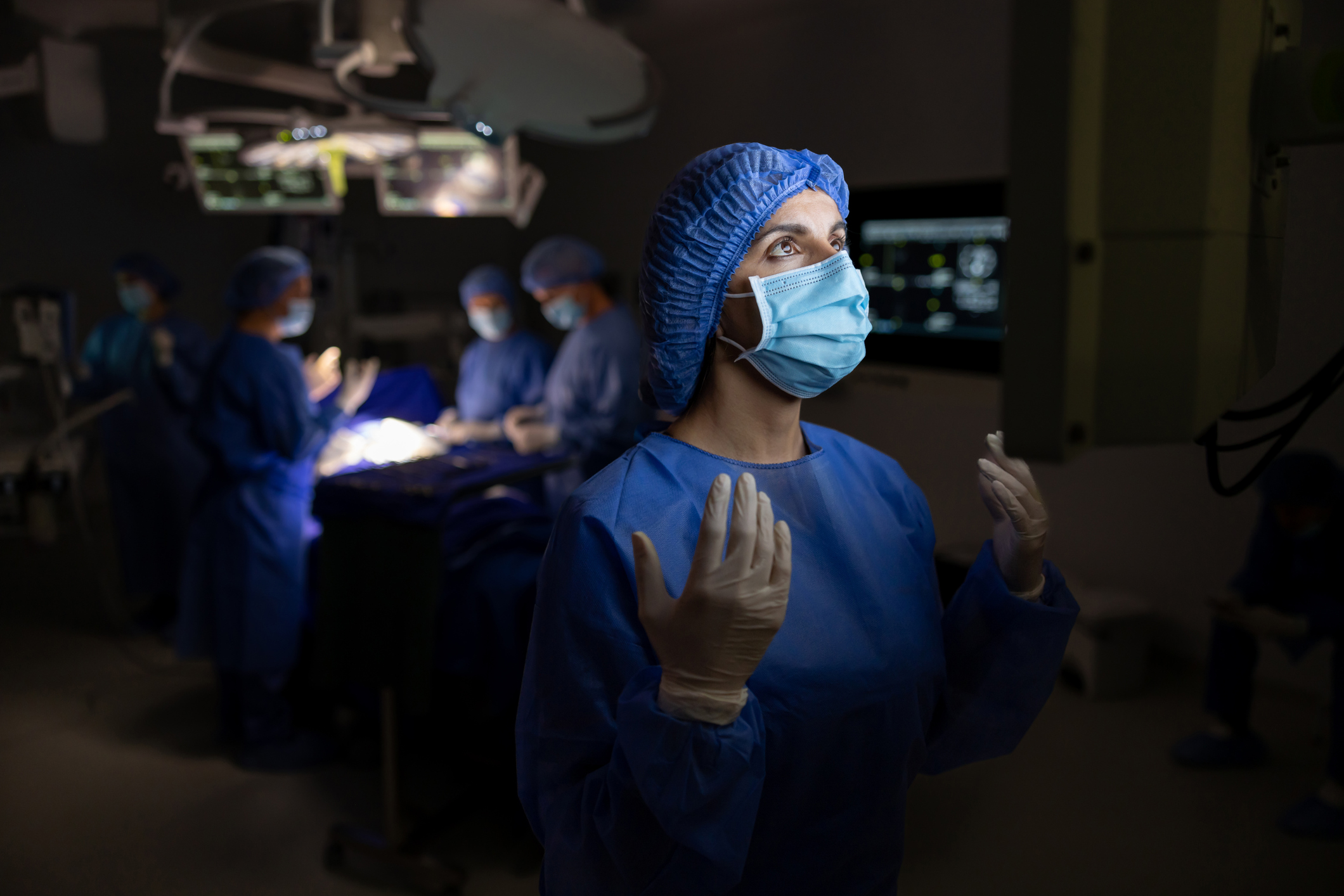 Surgeon protecting her hands