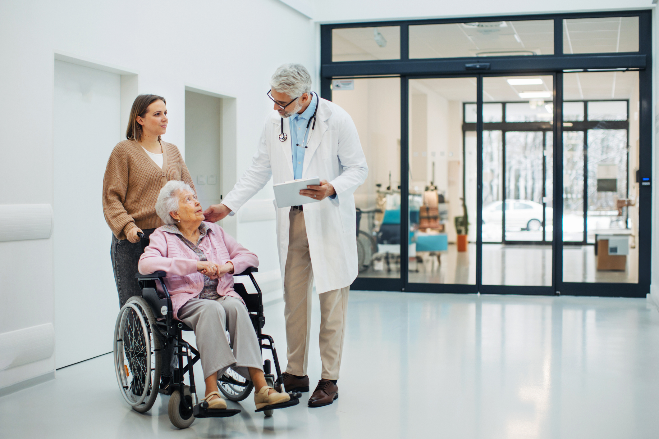Woman in wheelchair talking to doctor