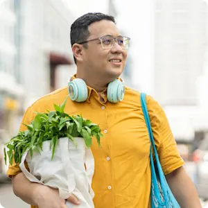 Man walking on street with groceries