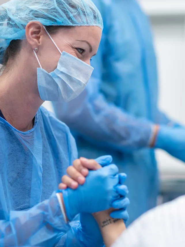 Nurse comforting patient