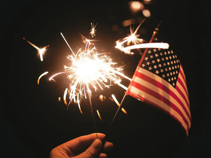 An American flag and a sparkler