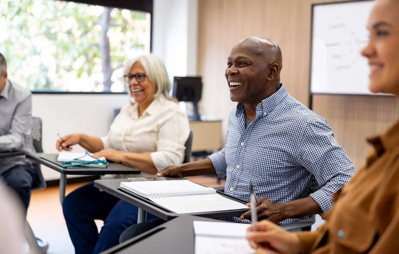Man smiling in class setting