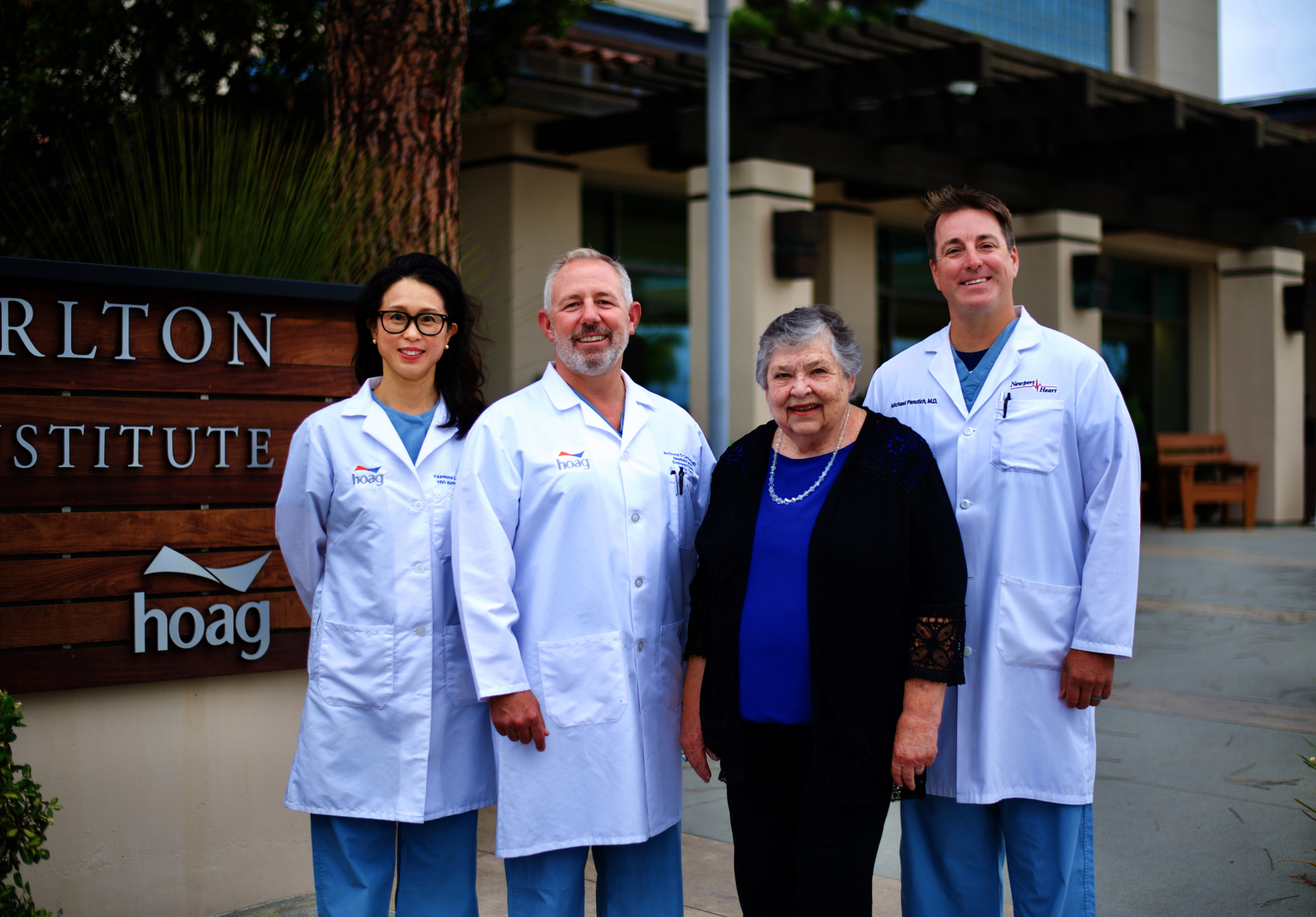 Lynda Strait stands with the heart rhythm team that saved her life