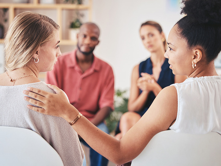 Women comforting each other 