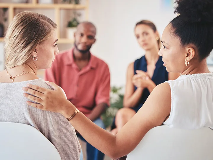 Women comforting each other 