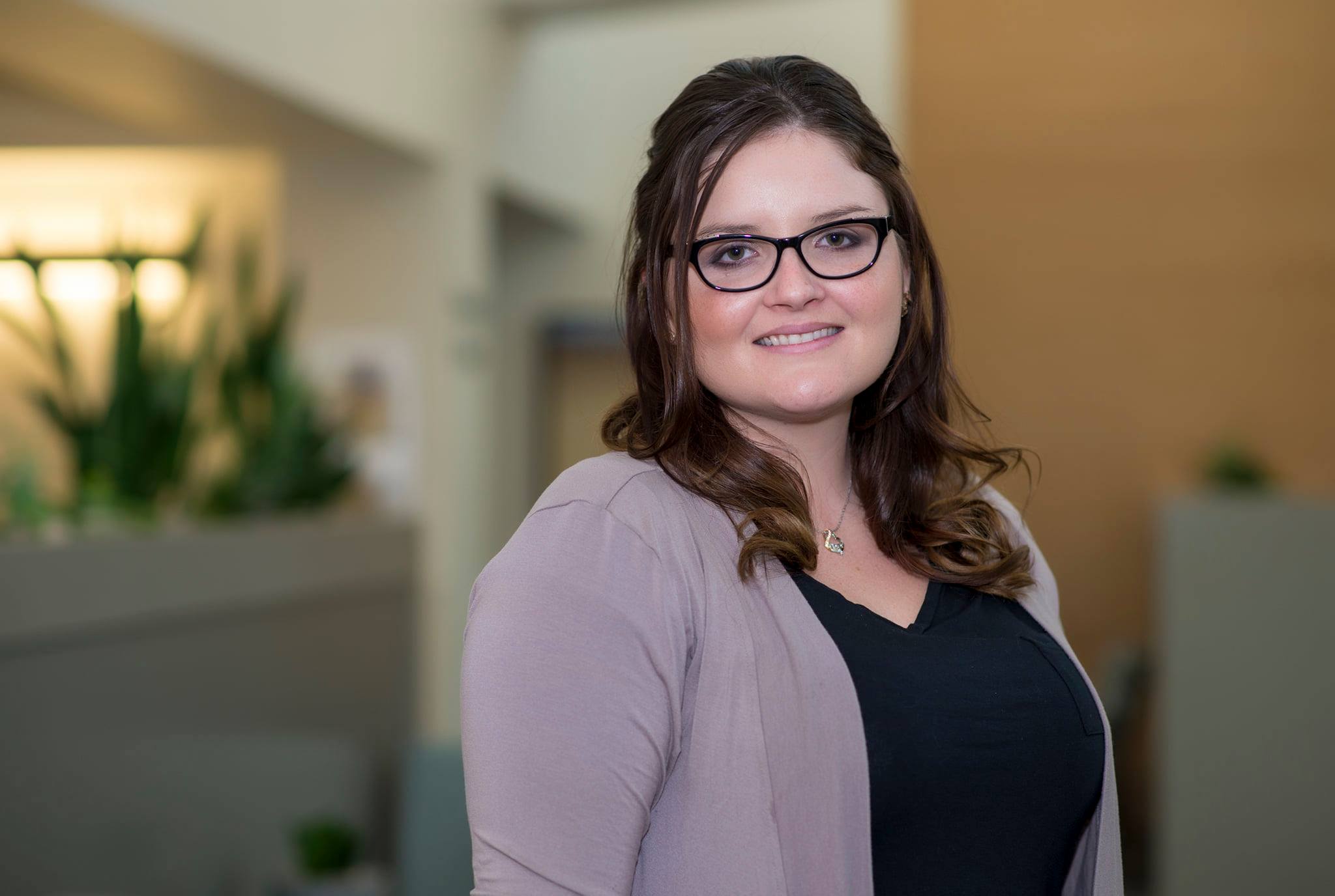cancer treatment patient smiles for camera while telling her story