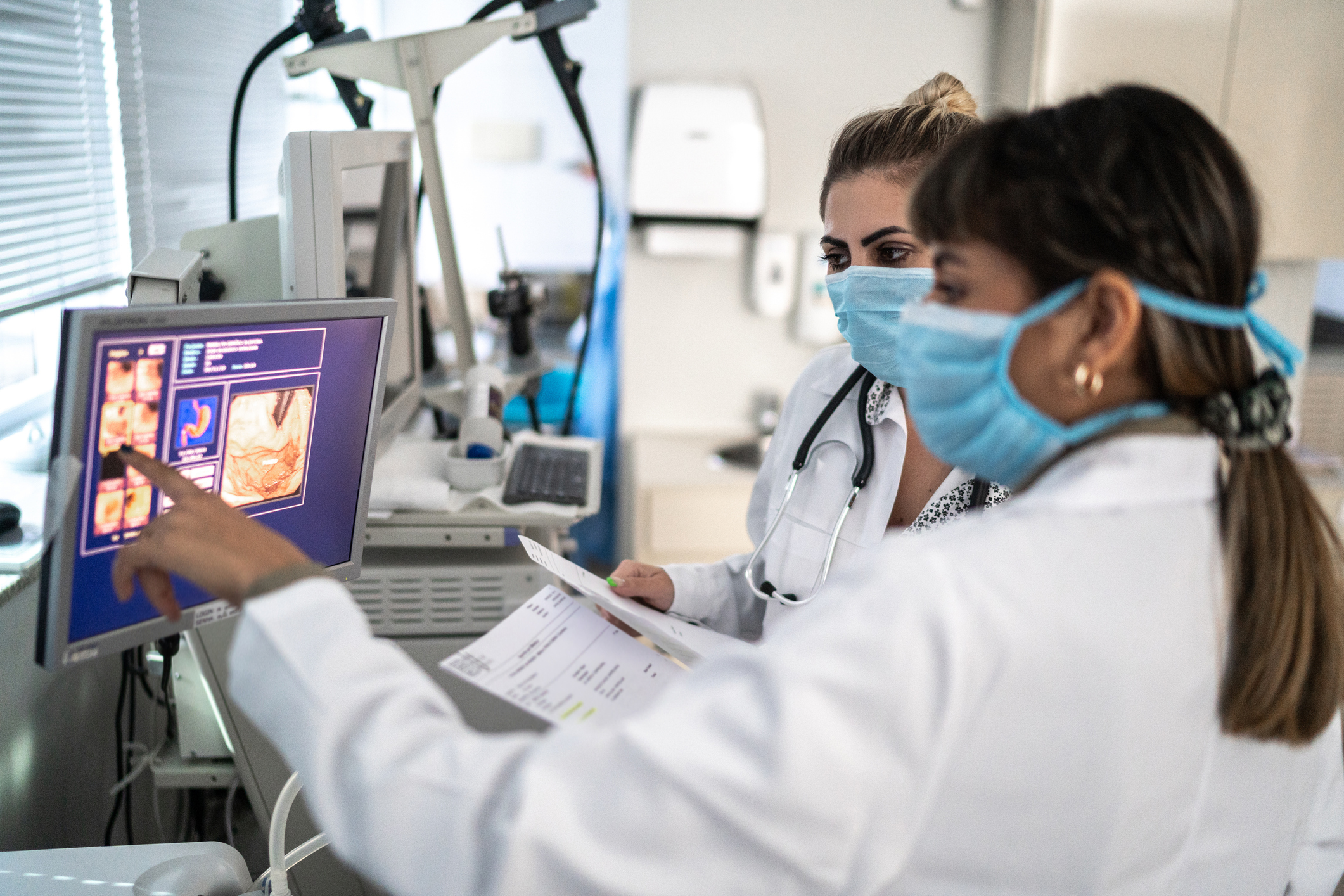 Doctors checking screen