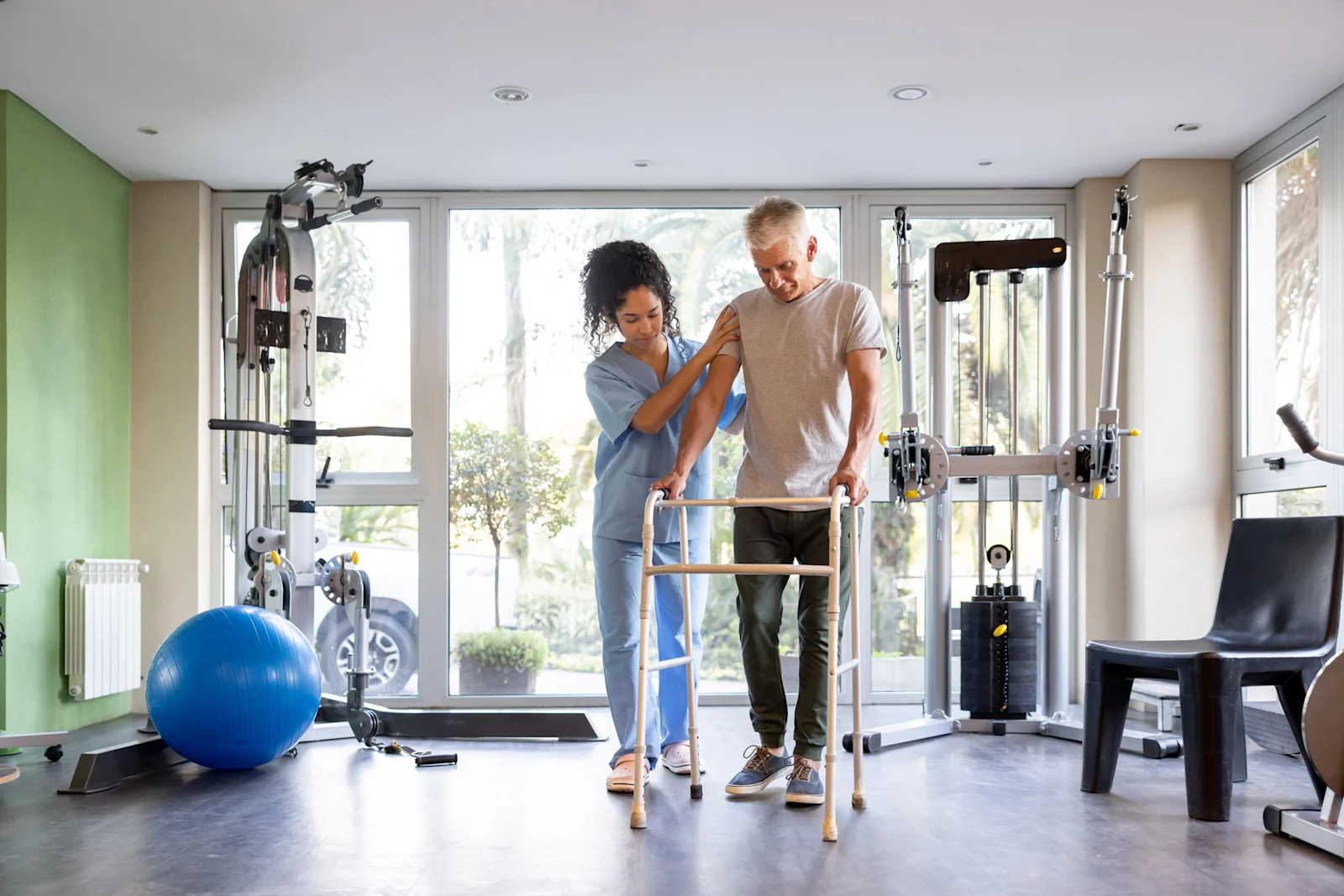Nurse helping patient rehab an injury