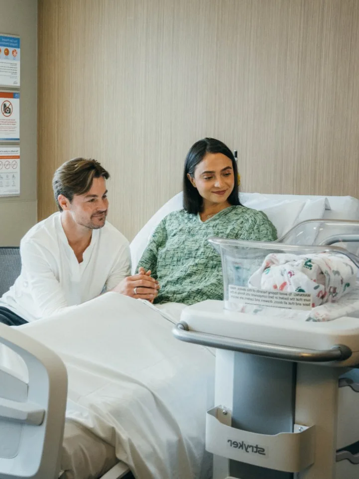 Mother & father with newborn baby in LDR suite
