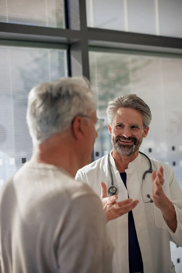 Doctor smiling while talking to patient