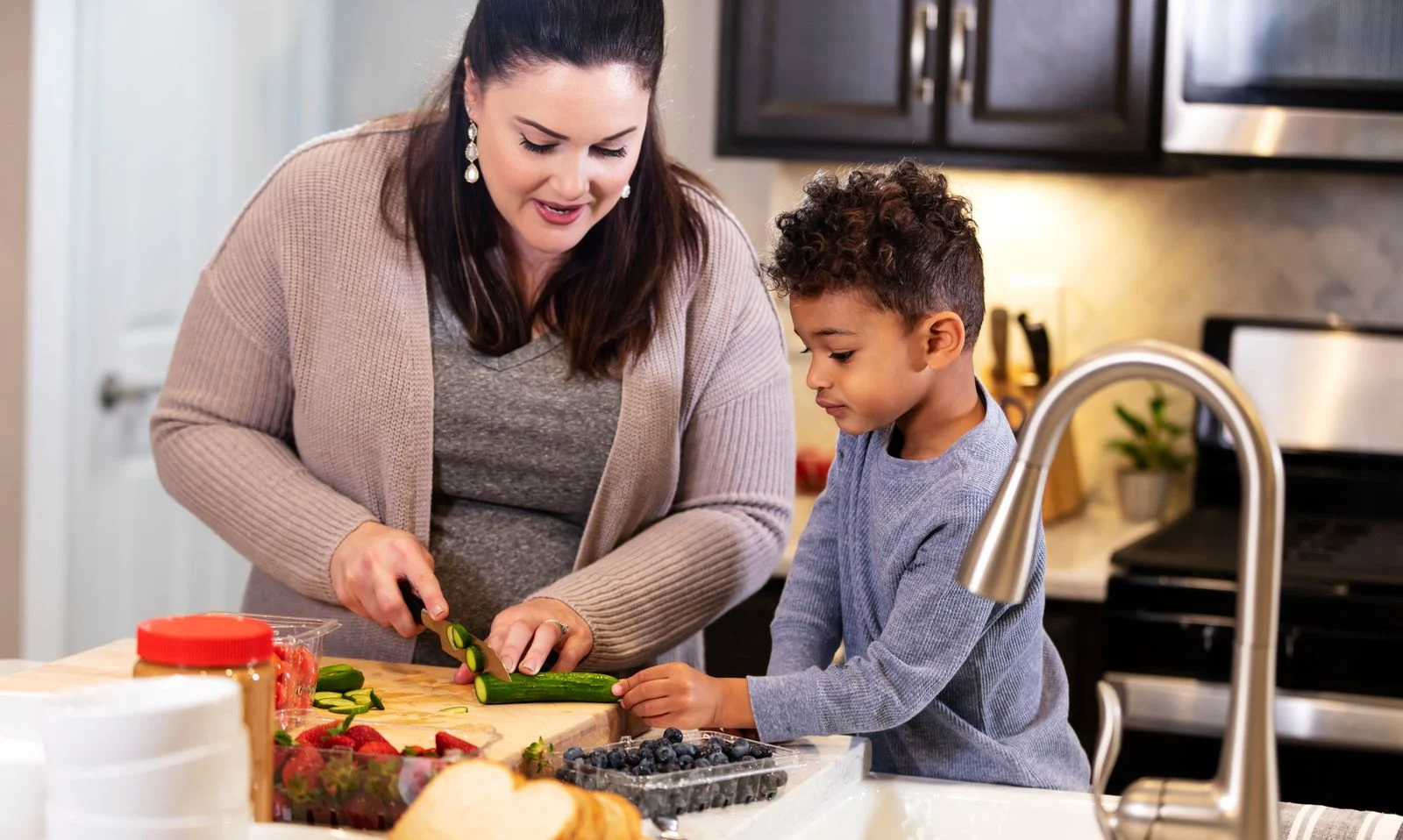 Making food with his daughter