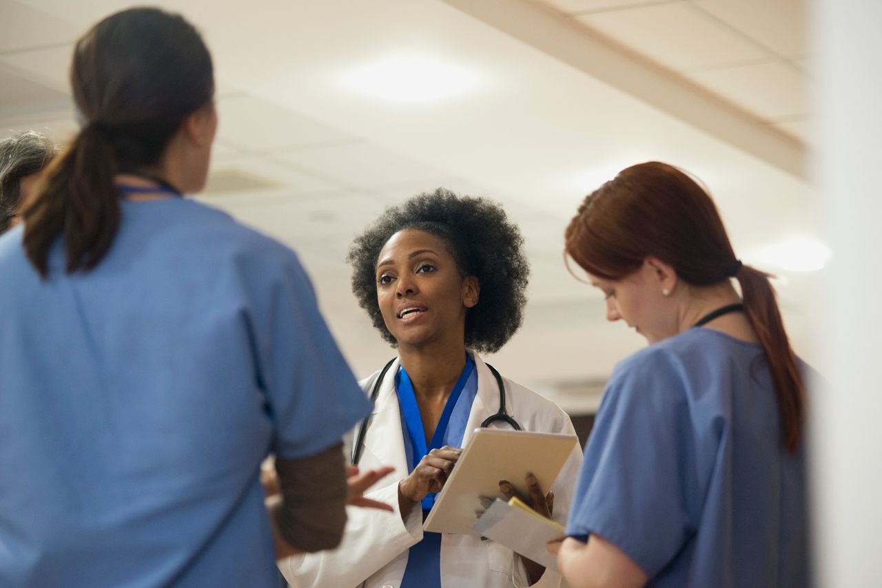 Doctors and nurses talking together