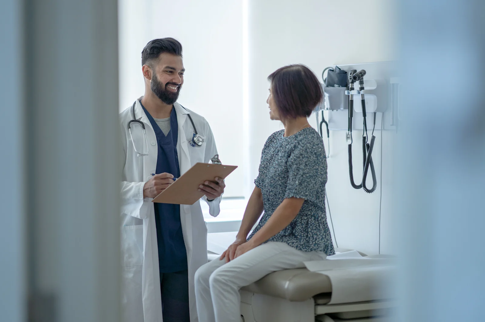 Doctor diagnosing patient